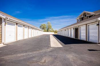 A long row of garage doors are closed.